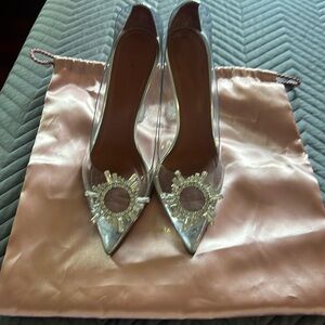 Amina Muaddi plexi pump with crystal brooch